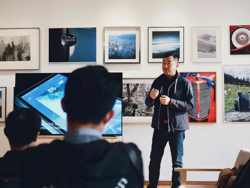 Professional man explaining a concept to a group.
