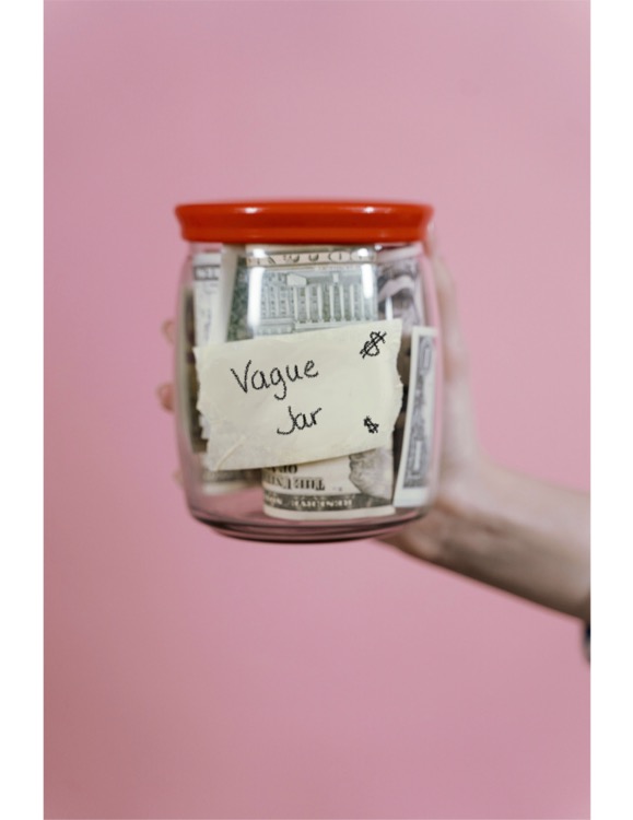 Jar labeled “Vague Jar” with money inside, symbolizing team awareness of vague communication